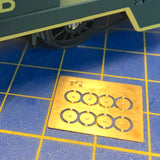 A set of four pairs of brass wheel centre nut covers.